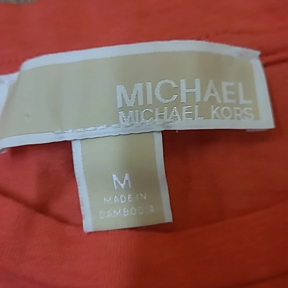 Michael Kors Orange Short Sleeve Top with Lace-Up Detail used good condition‎